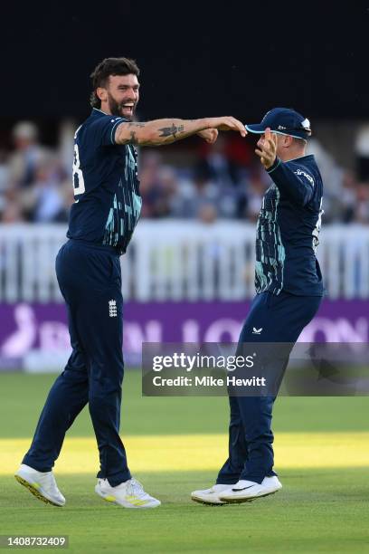 Reece Topley of England celebrates with Jason Roy after dismissing Yuzvendra Chahal of India for his fifth wicket during the 2nd Royal London Series...