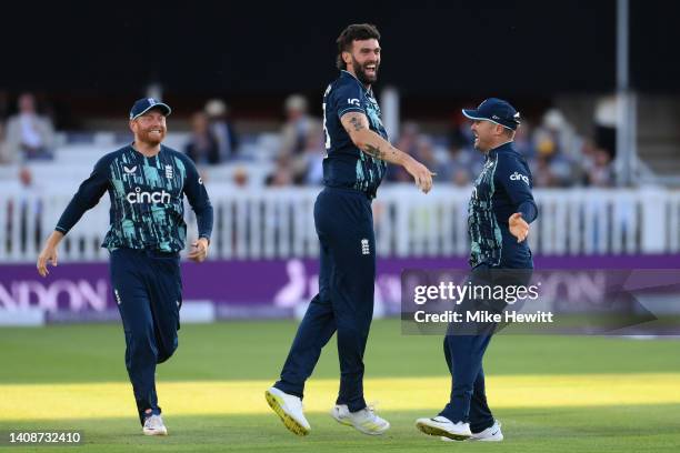 Reece Topley of England celebrates with Jonny Bairstow and Jason Roy after dismissing Yuzvendra Chahal of India for his fifth wicket during the 2nd...