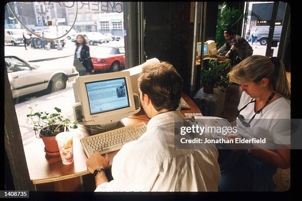 Use Computer Cafe Unidentified individuals use a computer at Cyber Cafe September 22 ...
