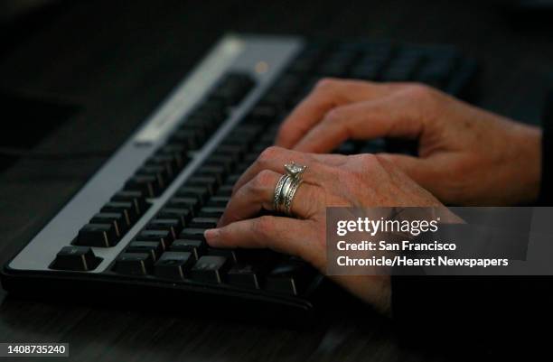 Veteran 911 dispatcher Lisa Hoffmann enters a suspect's description into the computer while handling a call on her final day on the job in San...