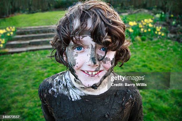 boys smiling face covered in mud - people covered in mud stock pictures, royalty-free photos & images