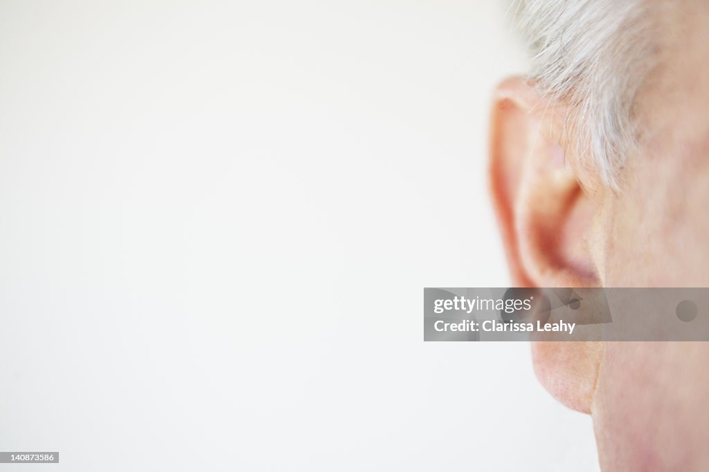 Close up of older persons ear