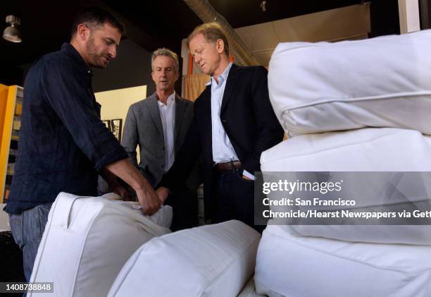 Foam Order store owner Mike Gorham inspects sofa cushions with Tony Stefani and documentary filmmaker James Redford in San Francisco, Calif. On...