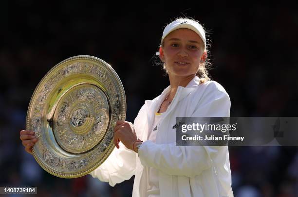 Elena Rybakina of Kazakhstan celebrates with the trophy after victory against Ons Jabeur of Tunisia during the Ladies' Singles Final match on day...