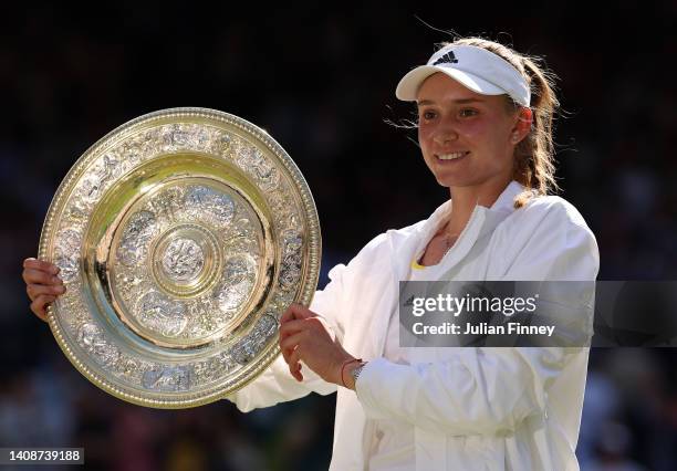 Elena Rybakina of Kazakhstan celebrates with the trophy after victory against Ons Jabeur of Tunisia during the Ladies' Singles Final match on day...