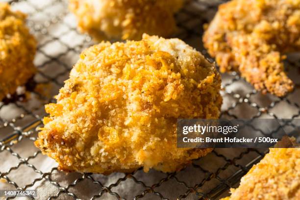 close-up of food on cooling rack - chicken roasting oven stock pictures, royalty-free photos & images