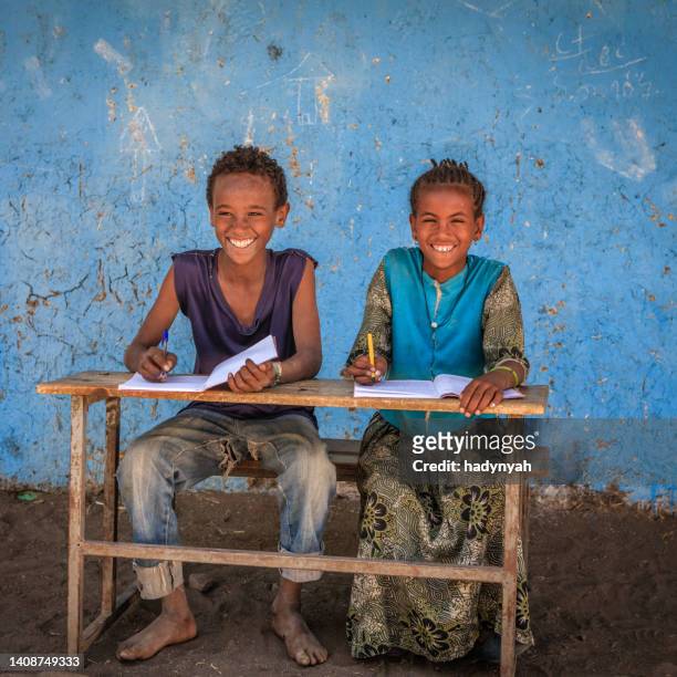 african children learning english language - east africa stock pictures, royalty-free photos & images