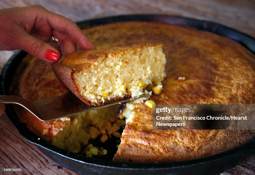 Chef/owner Dominica Rice-Cisneros cuts a slice of fresh baked cornbread at Cosecha Cafe in Oakland, Calif. on Tuesday, Sept. 4, 2018