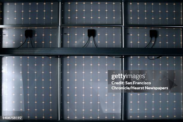 Solar panels for a microgrid power system are erected on the roof of a garage at the Kaiser Permanente Medical Center in Richmond, Calif. On Friday,...