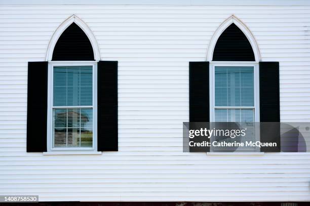 side view of white clapboard church in quaint new england town - funeral chapel stock pictures, royalty-free photos & images