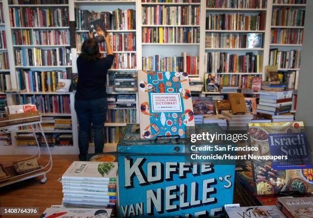 Celia Sack arranges the shelves in her Omnivore Books on Food cookbook store in San Francisco, Calif. On Thursday, Nov. 1, 2018.