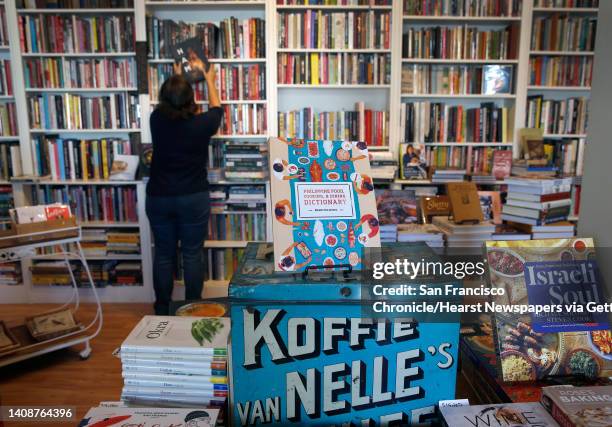 Celia Sack arranges the shelves in her Omnivore Books on Food cookbook store in San Francisco, Calif. On Thursday, Nov. 1, 2018.