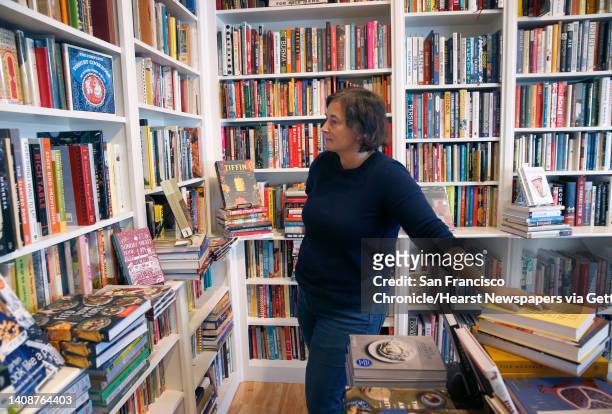 Celia Sack organizes the shelves in her Omnivore Books on Food cookbook store in San Francisco, Calif. On Thursday, Nov. 1, 2018.
