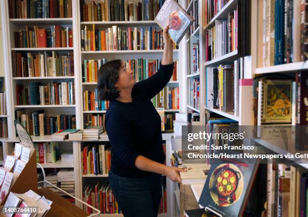 Celia Sack stocks the shelves in her Omnivore Books on Food cookbook store in San Francisco, Calif. On Thursday, Nov. 1, 2018.