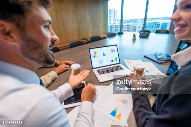 business people working on financial data on a laptop computer. - working on laptop in train top view stock pictures, royalty-free photos & images