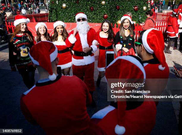 Costumed revelers come together for the annual SantaCon gathering at Union Square in San Francisco, Calif. On Saturday, Dec. 8, 2018. The event was...