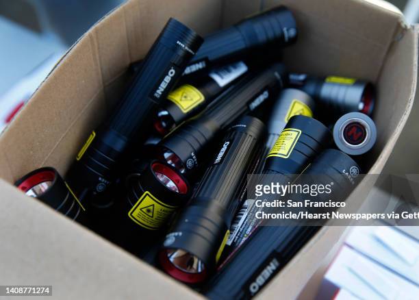 High powered flashlights are distributed to residents affected by the extended power outage at the PG&E community resource center at the Solano...