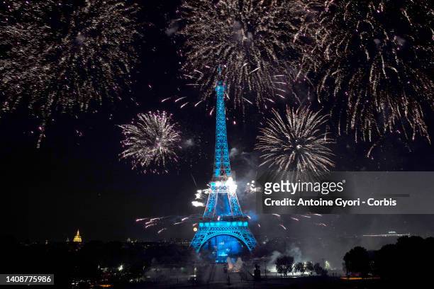 Fireworks explode above the Eiffel Tower as part of the annual Bastille Day celebrations on July 14, 2022 in Paris, France.