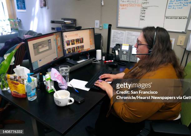 Kate Eisler speaks to a client calling a suicide hotline at Crisis Support Services of Alameda County in Oakland, Calif. On Tuesday, April 14, 2020....