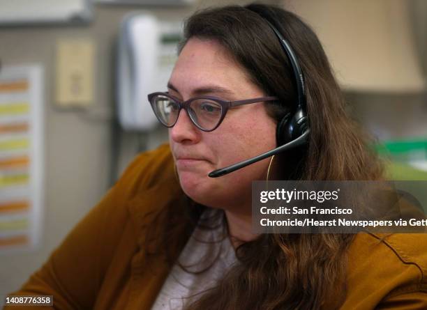 Kate Eisler speaks to a client calling a suicide hotline at Crisis Support Services of Alameda County in Oakland, Calif. On Tuesday, April 14, 2020....