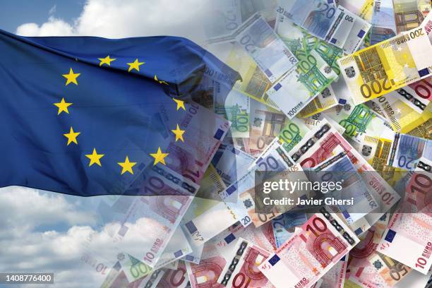 european union flag and cash euro banknotes - money politics fotografías e imágenes de stock