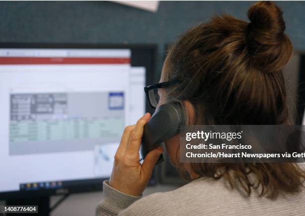 Marie Claude answers a call from a client on a suicide hotline at Crisis Support Services of Alameda County in Oakland, Calif. On Tuesday, April 14,...