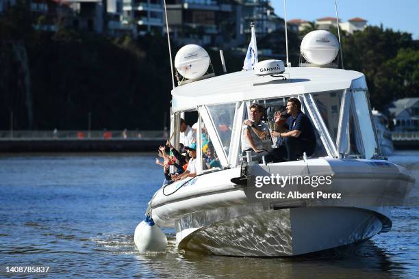 Adam Zampa and Shane Watson are seen with the trophy during the ICC Men's T20 Cricket World Cup Trophy Tour at Howard Smith Wharves on July 15, 2022...