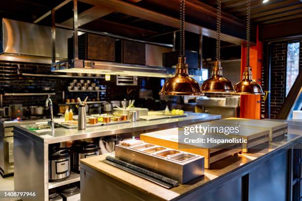 beautiful commercial kitchen at a restaurant - restaurant kitchen stock pictures, royalty-free photos & images