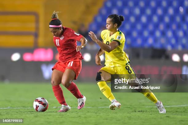 Desiree Scott of Canada fights for the ball with Kayla McCoy of Jamaica during the semifinal between Canada and Jamaica as part of the 2022 Concacaf...
