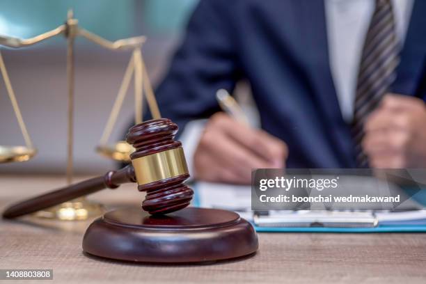 judge gavel with justice lawyers. - legal trial stock-fotos und bilder