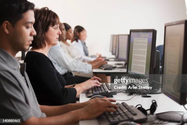 students learning in computer lab - college students computer lab stock pictures, royalty-free photos & images