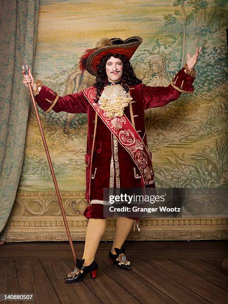 actor dressed in old-fashioned costume on stage - royalty free vintage images stock-fotos und bilder