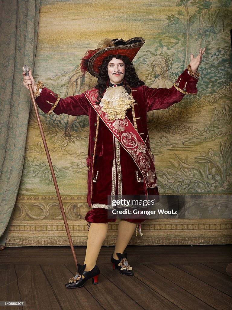 Actor dressed in old-fashioned costume on stage