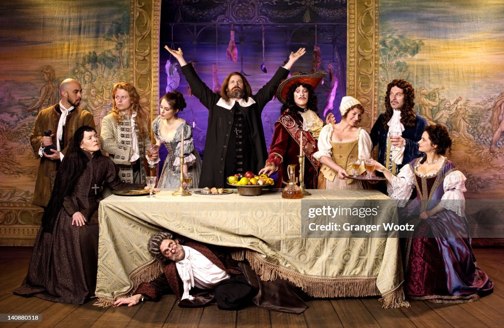 Actors in old-fashioned costumes on stage