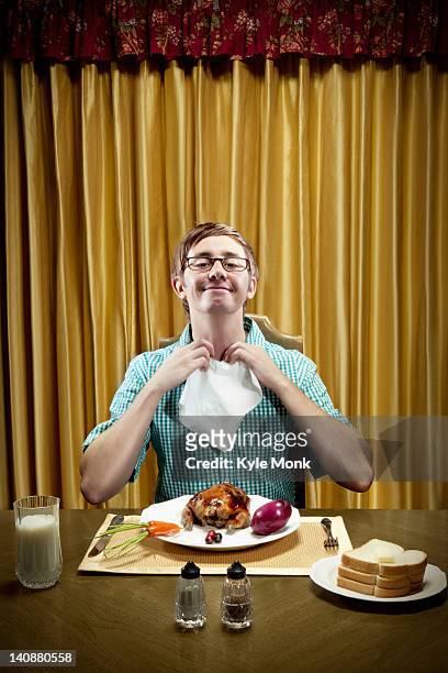 caucasian man preparing to eat dinner - napkin stock pictures, royalty-free photos & images