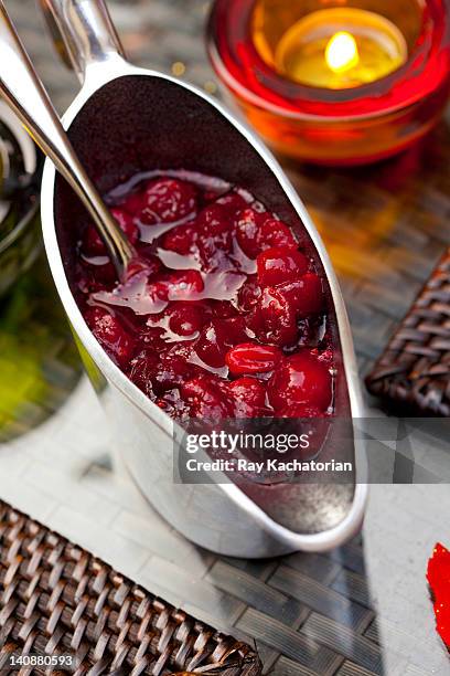 cranberry sauce in pitcher on table - cranberry sauce stock pictures, royalty-free photos & images