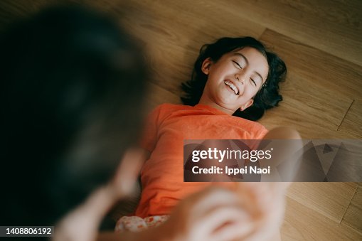 Young girl having her feet tickled Young girl having her feet tickled