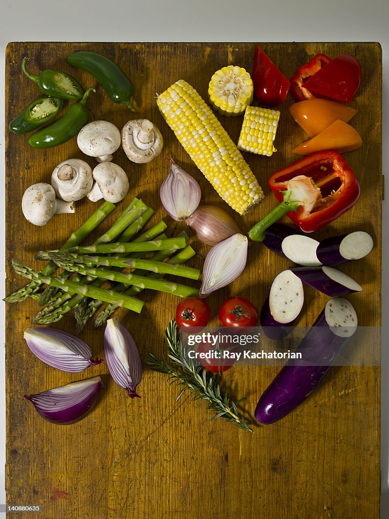 Variety of fresh vegetables on cutting board