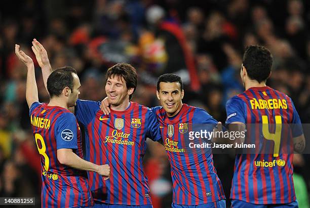 Lionel Messi of FC Barcelona celebrates scoring his sides second goal with his teammates Andres Iniesta , Pedro Rodriguez and Cesc Fabregas during...