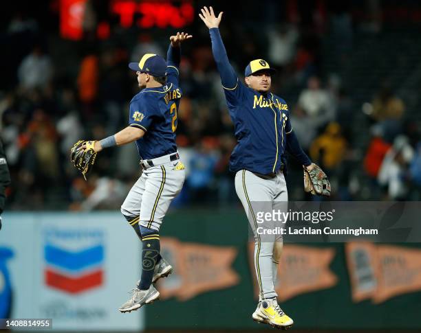 Luis Urias and Willy Adames of the Milwaukee Brewers celebrate after a win against the San Francisco Giants at Oracle Park on July 14, 2022 in San...