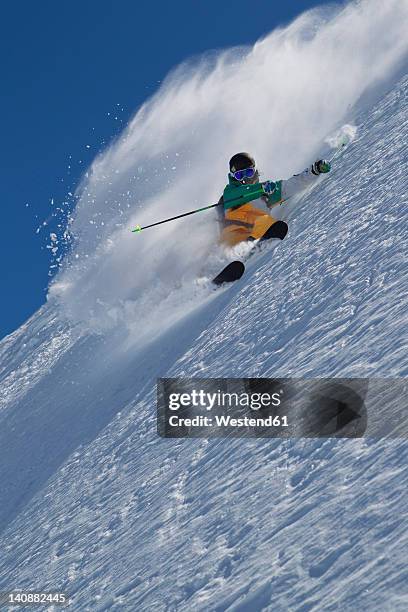 austria, tyrol, pitztal, mature man doing freestyle skiing - freestyle skiing stock-fotos und bilder