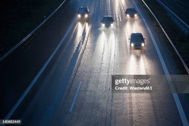 germany, bavaria, cars on autobahn during rain - crash barrier stock pictures, royalty-free photos & images