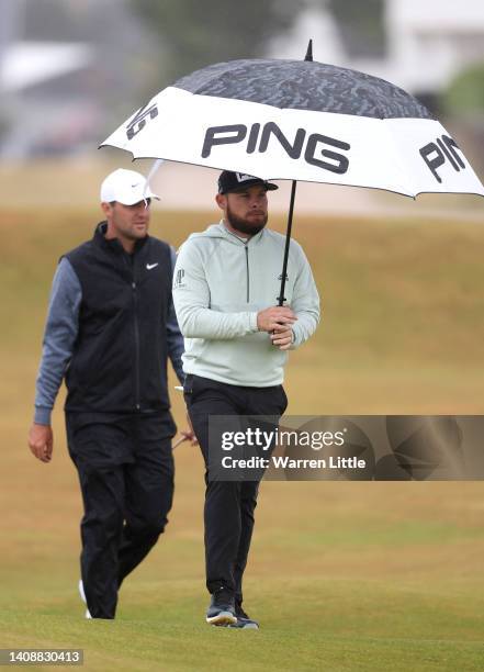 Tyrrell Hatton of England and Scottie Scheffler of The United States make their way down the second hole during Day Two of The 150th Open at St...