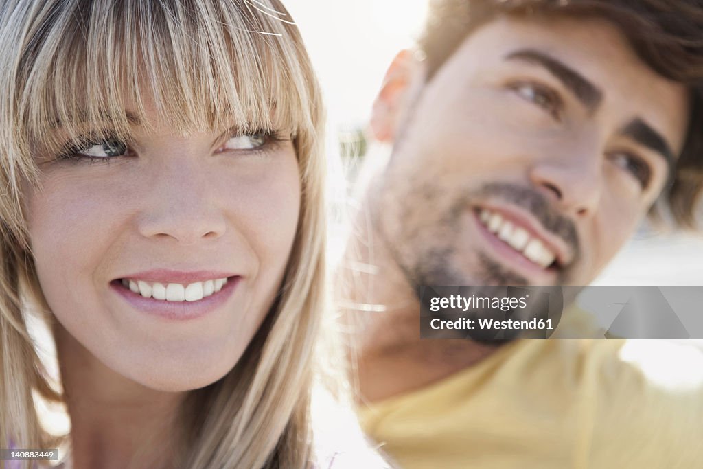 Germany, Cologne, Young couple smiling, close up