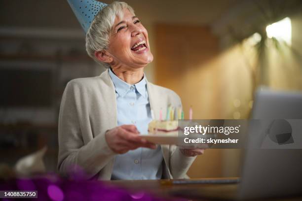 celebrating birthday through video call due to social distancing! - older woman birthday stock pictures, royalty-free photos & images