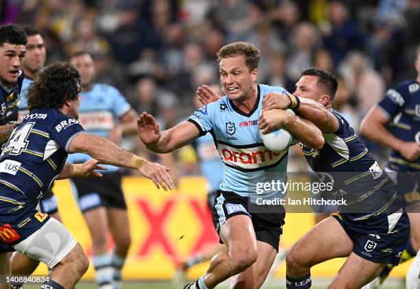 Matt Moylan of the Sharks makes a break during the round 18 NRL match between the North Queensland Cowboys and the Cronulla Sharks at Qld Country...