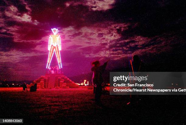 Lit by neon, the 50-foot-tall Burning Man structure glowed in the early dawn of Sunday, September 6 just hours before it was set ablaze to conclude...