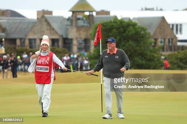 Mark Calcavecchia of the United States walks from the 16th green with wife and caddie Brenda Calcavecchia during Day Two of The 150th Open at St...