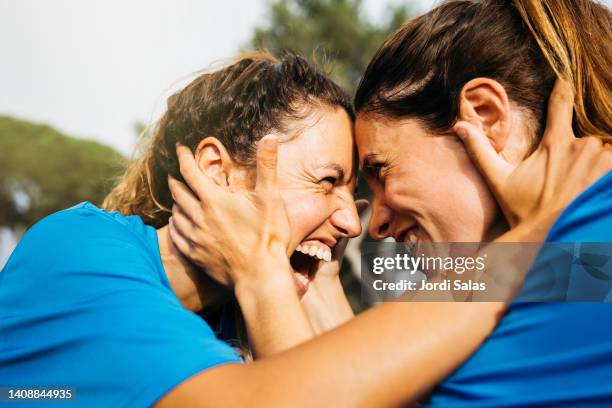 female soccer mate celebrating - soccer sport fotografías e imágenes de stock