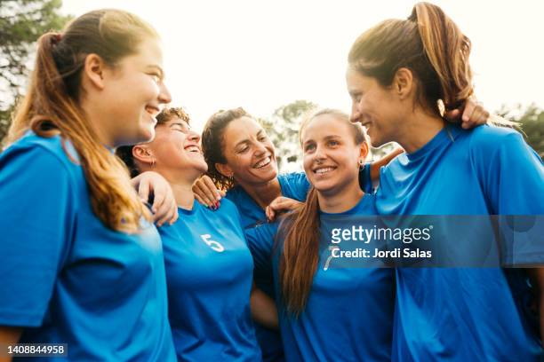 portrait of a female soccer - huddles in sport fotografías e imágenes de stock